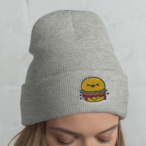 May include: Gray beanie with a smiling cartoon burger embroidered on the front.