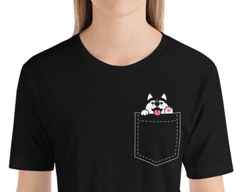 May include: Black t-shirt with a white pocket and a cartoon husky dog peeking out of the pocket.