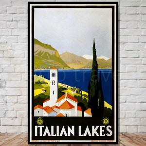 May include: Vintage travel poster advertising Italian Lakes. The poster features a colorful illustration of a lake with mountains in the background, a church with a tall tower, and a cypress tree. The text "ITALIAN LAKES" is printed in bold, black letters at the bottom of the poster.
