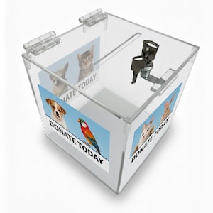 May include: Clear acrylic donation box with a slot for contributions. The box features images of pets, including a dog, cat, parrot, and rabbit, with the text "DONATE TODAY". Includes a lock and key for security.