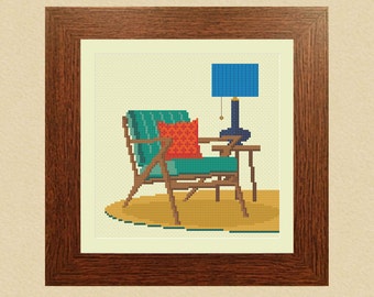 May include: A teal armchair with a red pillow sits on a yellow rug next to a side table with a blue lamp.