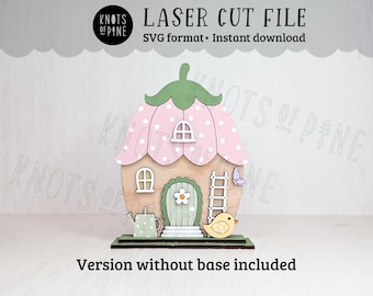 Könnte beinhalten: Ein lasergeschnittenes Holz-Feenhaus mit rosa und grünem Blumendesign. Das Haus hat eine Tür, Fenster, eine Leiter und einen Vogel. Der Text lautet "LASER CUT FILE" und "SVG format • Instant download".