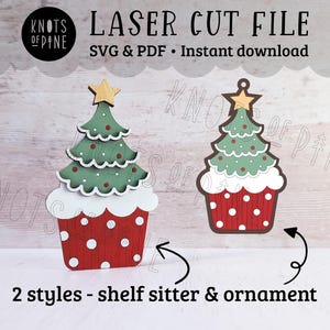 May include: Two styles of laser cut Christmas tree ornaments. One is a shelf sitter and the other is an ornament. Both are red and white with a green tree on top. The text "KNOTS OF PINE" is visible in the background.