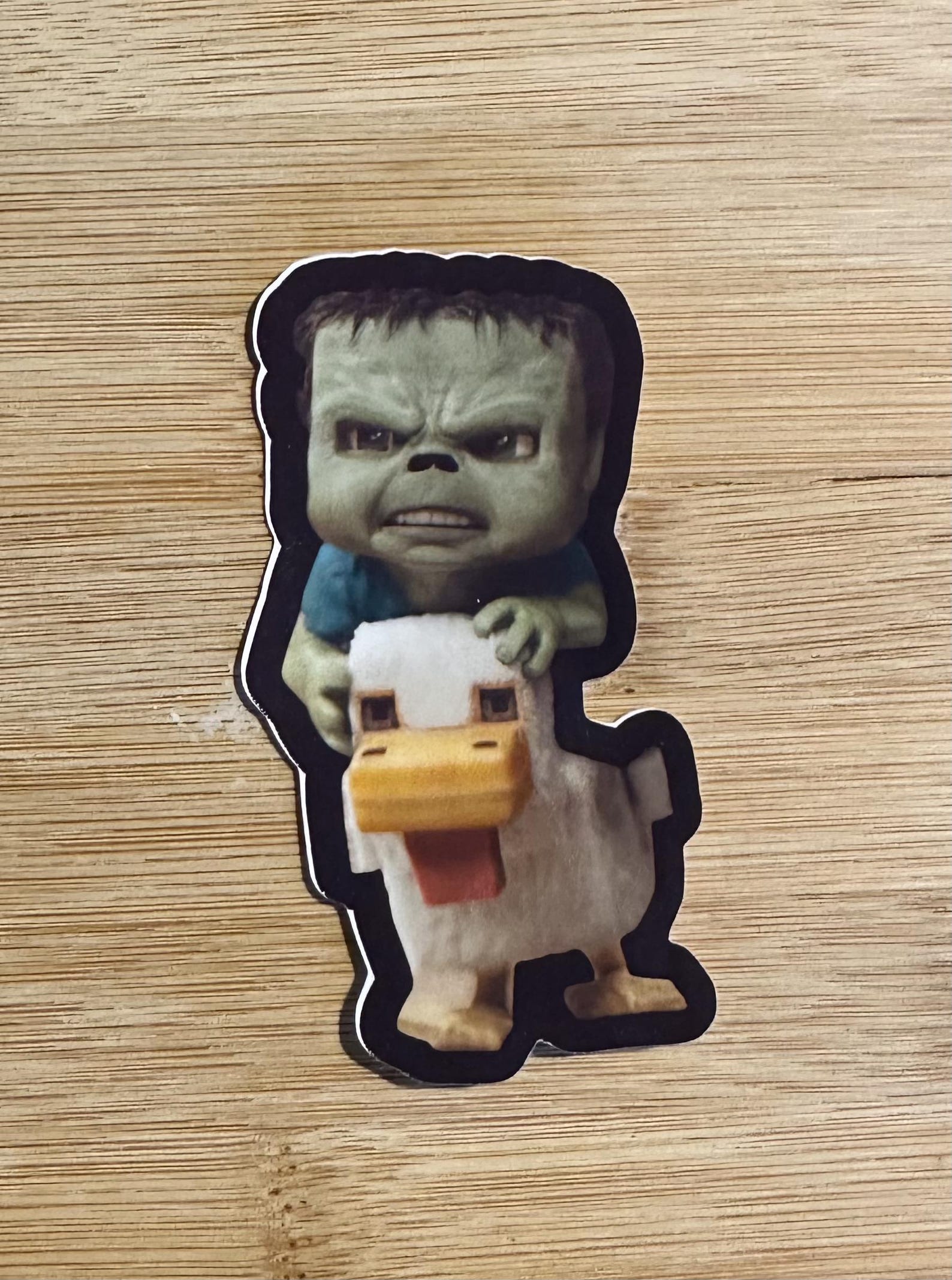 A sticker with a chicken jockey from the Minecraft movie