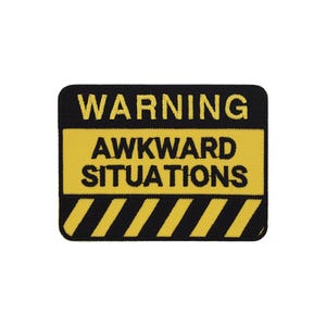 May include: Yellow and black warning sign with the text "WARNING" and "AWKWARD SITUATIONS" in black.