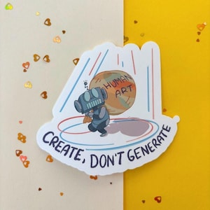 May include: A die-cut sticker featuring a gray robot carrying a large, tan, spherical object labeled HUMAN ART. The design includes blue and red vertical lines, a circular floor shadow, and the text CREATE, DON'T GENERATE in dark blue.
