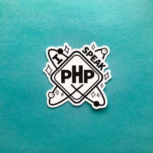 May include: A white sticker with the text "I SPEAK PHP" in a black, diamond-shaped design. The sticker has a teal background and features a stylized atom and starburst elements.