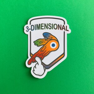 May include: A white sticker with the text "3-DIMENSIONAL" in rainbow colors. The sticker features a cartoon design of an orange and red object with an eye and a thumbs-up hand.