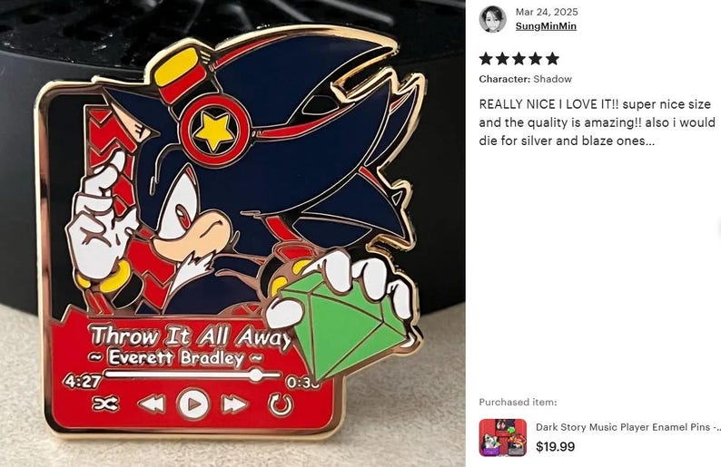 May include: Enamel pin featuring a character with black and red accents, holding a green gem. The pin is designed as a music player with the text "Throw It All Away" and the artist's name. The pin has a gold border.
