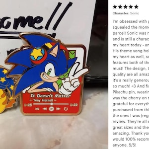 May include: Enamel pins featuring Sonic the Hedgehog and Pikachu. The Sonic pin shows Sonic giving a peace sign, with the text "It Doesn't Matter." The Pikachu pin is wearing a nightcap. A fun collectible for fans.