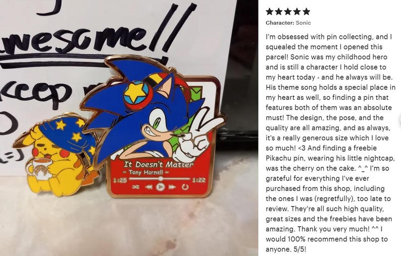 May include: Enamel pins featuring Sonic the Hedgehog and Pikachu. The Sonic pin shows Sonic giving a peace sign, with the text "It Doesn't Matter." The Pikachu pin is wearing a nightcap. A fun collectible for fans.