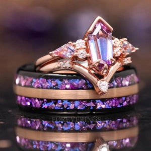 May include: A set of two wedding bands with a rose gold finish. The top band features a large, iridescent purple gemstone with smaller accent stones. The bottom band is black with embedded purple glitter.