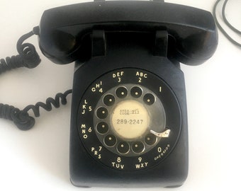 Black 1960s classic rotary telephone. (missing microphone). Western Electric.