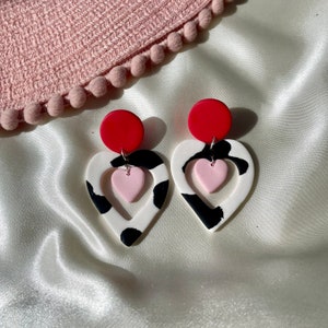 Cut out heart shaped polymer clay cow print earrings with pink and red details and charm image 7