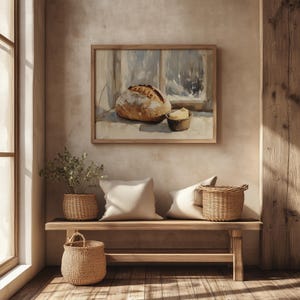 May include: A rustic interior scene featuring a wooden bench with woven baskets and pillows. A framed painting of bread and butter hangs above. The room has a warm, inviting atmosphere with natural light.