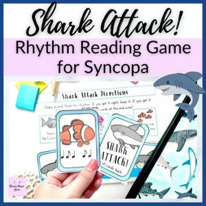 Peut inclure: Un jeu de lecture rythmique Shark Attack pour la syncope comprenant une feuille d'instructions imprimée et deux cartes de jeu. Une carte montre un poisson-clown avec des notes de musique, l'autre un requin avec le texte SHARK ATTACK.