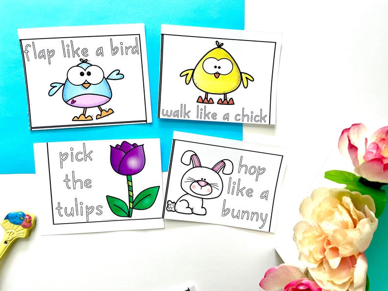 May include: Four printable cards with black and white illustrations and text. The cards feature a blue bird, a yellow chick, a white bunny, and a purple tulip. The text on the cards reads "flap like a bird", "walk like a chick", "hop like a bunny", and "pick the tulips".