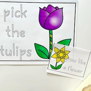 May include: A printable activity for kids featuring a purple tulip with green leaves and the text "pick the tulips". A separate card with a yellow flower and the text "grow like a flower" is also included.