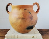 Native American style clay pot with two handles. Terra cotta gathering pot.