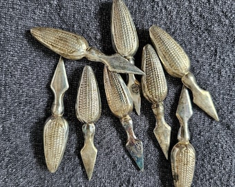 Silver-plated English corn holders, set of eight.