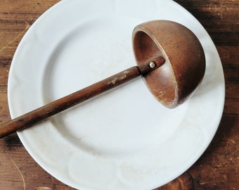 Antique wooden ladle, handcrafted.
