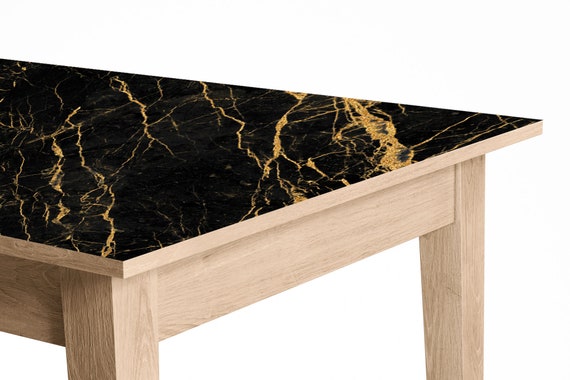 Black and store gold marble table