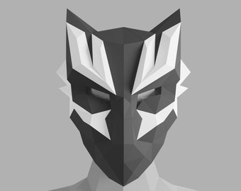 May include: A black and white origami mask with a geometric design. The mask has a sharp, angular shape and features a stylised face with pointed ears.