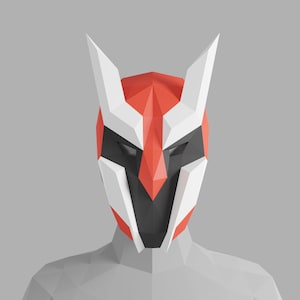 May include: A white and red origami mask with black eye holes and a pointed nose. The mask is made of paper and has a geometric design.