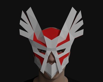 May include: A white and red paper mask with a geometric design. The mask has a sharp, angular shape with wings on the sides. The mask is designed to cover the eyes and nose.