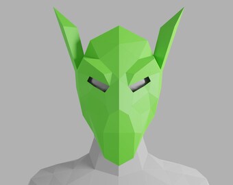 May include: A green, geometric, origami-style mask with pointed ears. The mask has two eye holes and a sharp, angular design.