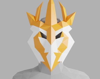May include: A white and yellow origami mask with a crown-like design. The mask is made of paper and has a geometric pattern.