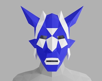 May include: A blue and white origami mask with a geometric design. The mask has a triangular nose and eyes, and a wide mouth.