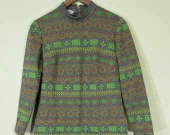 May include: A long-sleeved dress with a high neck and a geometric pattern in shades of green, orange, and gray.