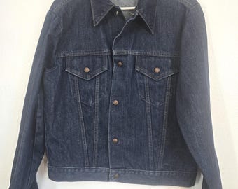 Vintage 60s 70s mystery brand denim trucker jean jacket! Snap front, 46 chest, no hand pockets, care and content tag remains! near mint!