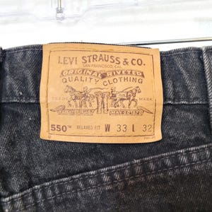 1996 Levi Strauss 550 Relaxed Fit Jeans (actual W 30 L 31) charcoal black orange tab brown label very near mint condition USA made!