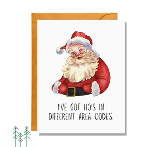 May include: A Christmas card featuring a watercolor illustration of Santa Claus winking. Santa is wearing a red suit and hat with white trim. The card has the text "I'VE GOT HO'S IN DIFFERENT AREA CODES."