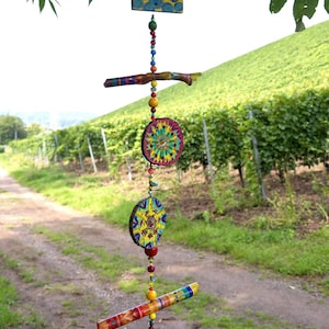 Mobile made of painted wood with beads in between/wind chime