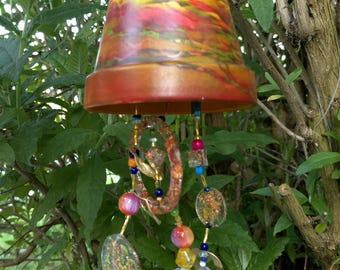 Hanging decoration/mobile made from a painted clay pot, various resin elements and beads/light catcher