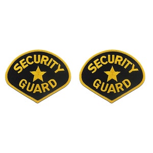 May include: Two black and gold embroidered patches with the text "SECURITY GUARD" and a gold star in the center.