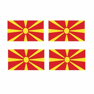 May include: Four red flags with a yellow sun and rays in the center. The flags are arranged in a 2x2 grid.