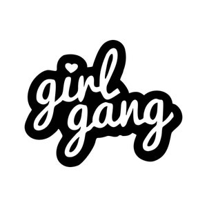 May include: Black and white sticker with the text "girl gang" in a handwritten style.