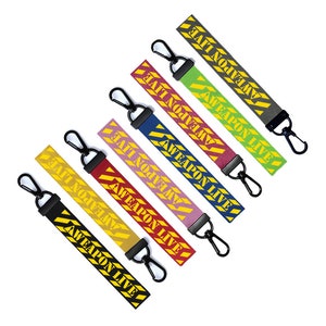 May include: Set of seven keychains with black, red, pink, blue, green, yellow, and gray striped fabric. Each keychain has a black metal ring and a yellow tag with the text "WEAPON LIVE" printed in black.