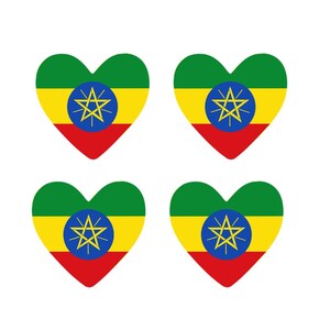 May include: Four heart-shaped designs featuring the Ethiopian flag. Each heart has a green top, yellow middle, and red bottom, with a blue circle and a yellow star in the center.