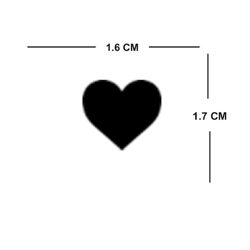 May include: A black heart-shaped sticker measuring 1.6 cm wide and 1.7 cm tall.