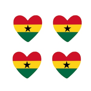 May include: Four heart-shaped designs featuring the flag of Ghana. Each heart has a red top, a yellow middle with a black star, and a green bottom. The hearts are arranged on a white background.