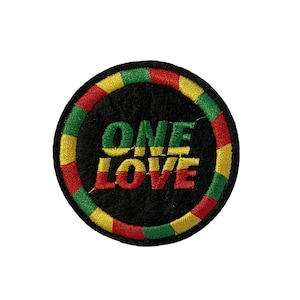 May include: A round, black embroidered patch with a yellow, green and red border. The patch says "ONE LOVE" in a stylised font.