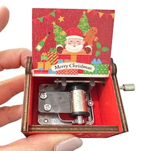 Kerstmuziekdoos met slinger: rode vintagestijl, feestmelodie