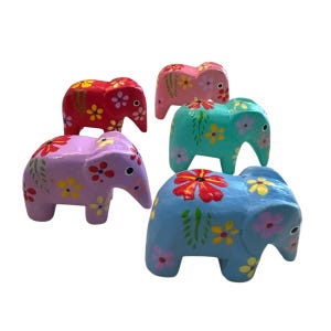 May include: Five hand-painted wooden elephant figurines in various colors: red, pink, teal, purple, and blue. Each elephant is decorated with floral patterns in contrasting colors, including yellow and red.