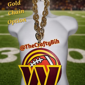 May include: A large medallion featuring a burgundy and yellow letter W and a football graphic, suspended from a thick gold-colored plastic chain. The text Gold Chain Option and @TheCraftyBih are visible on the image.