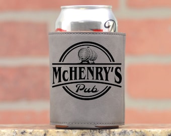 May include: A gray neoprene can cooler with a black logo that says "McHenry's Pub" with a graphic of two barrels.